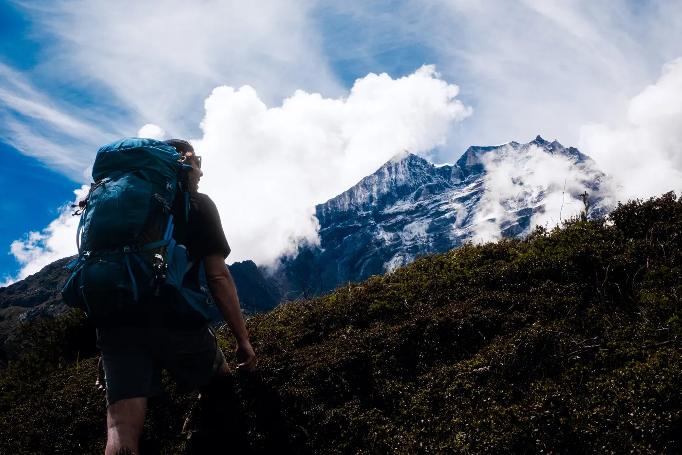 Photographer alone on a Himalayan pass during the Everest Three Passes trek