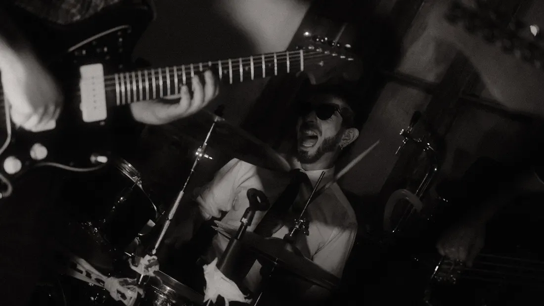 Musician performing under stage light